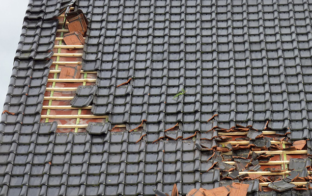 storm damaged tile roof